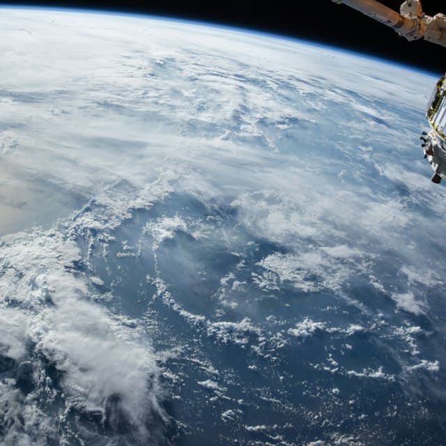 high quality sci-fi illustration. a lone astronaut in a spacesuit stands on a distant planet